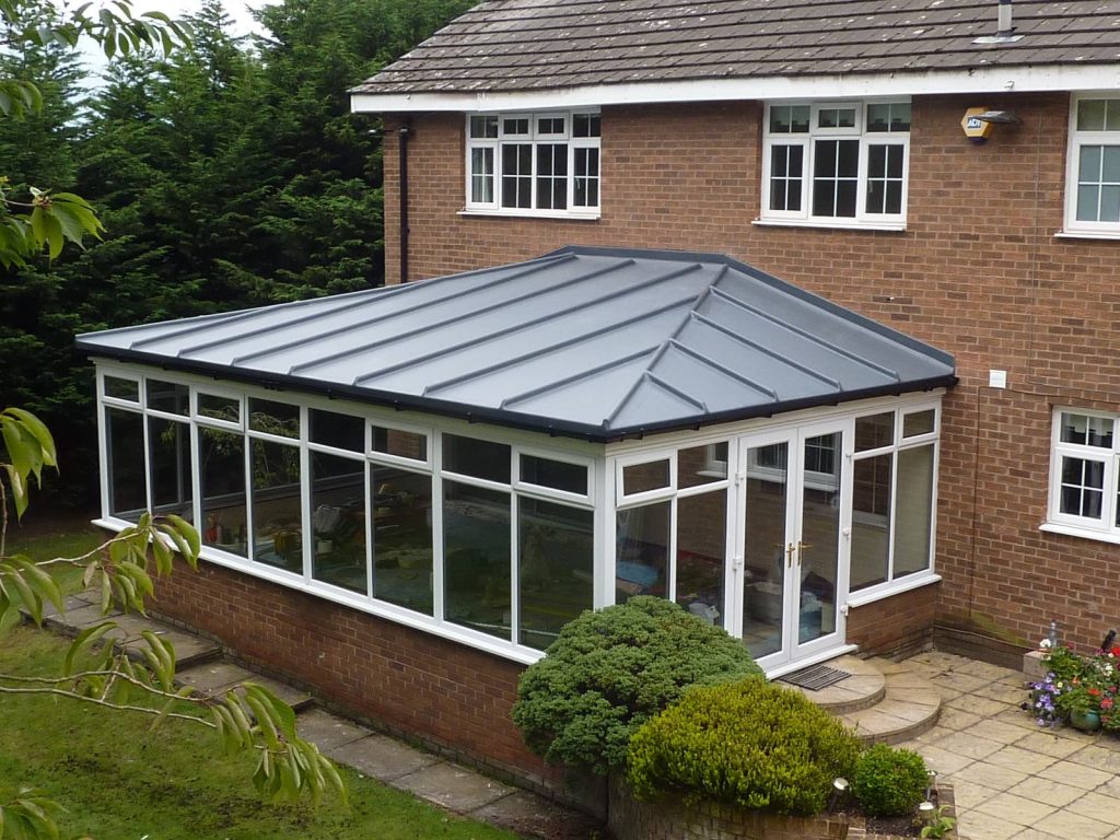 Large conservatory with a GRP fibreglass roof
