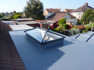 multi flat roof project with a roof lantern