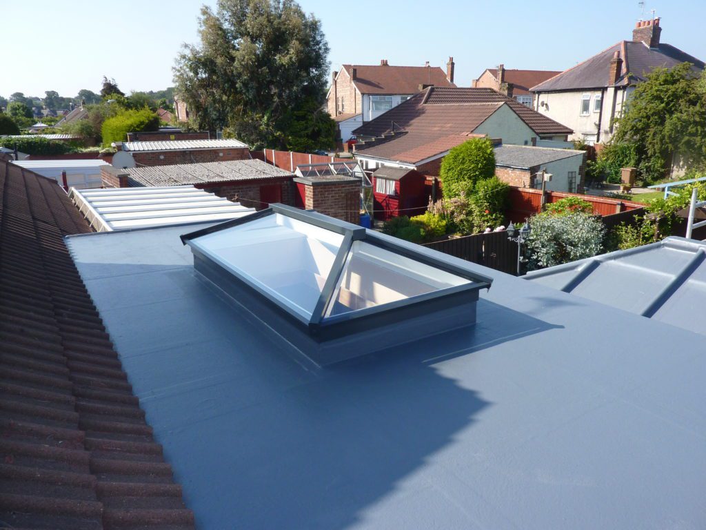 multi flat roof project with a roof lantern