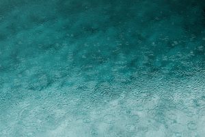 Heavy rain on a deep puddle